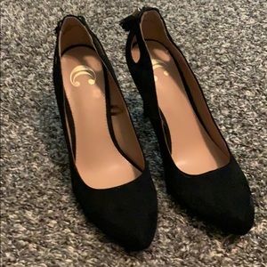 Black high heeled dress shoes